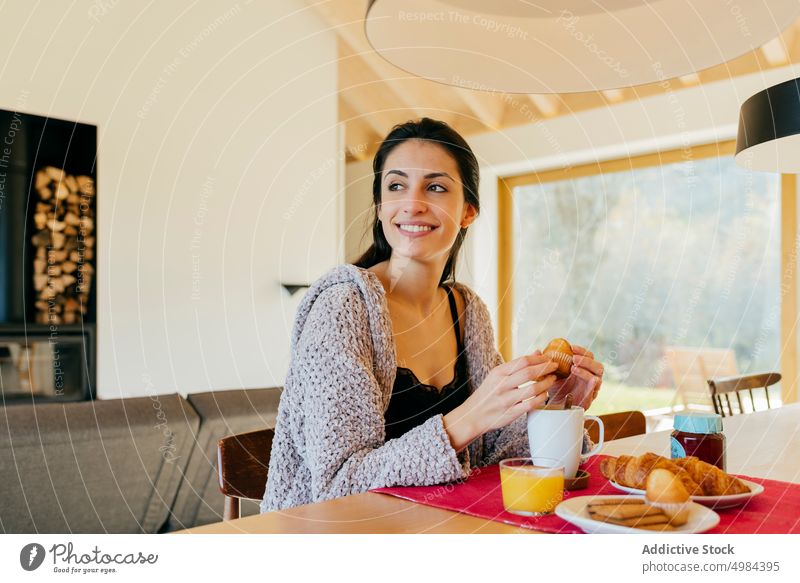 Young woman having breakfast cup window room hispanic lady attractive mug drink young big beautiful court cozy home rest relax beverage liquid lovely charming