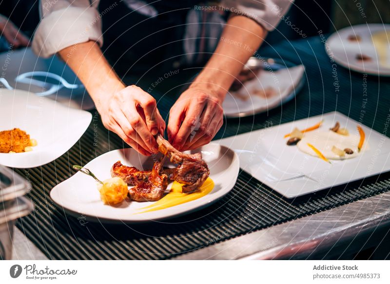 Crop man serving meat on plate chef serve sophisticated meal arrange gastronomy garnish luxury professional culinary gourmet dish occupation hands cuisine