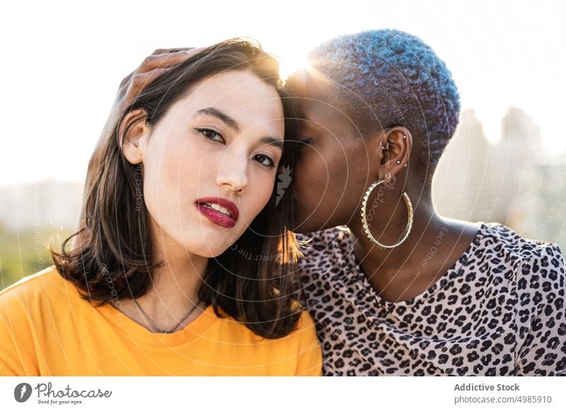 Multi ethnic lesbian couple hugging outdoors affection bonding touch lgbt homosexual togetherness young multi ethnic multiracial asian female beautiful