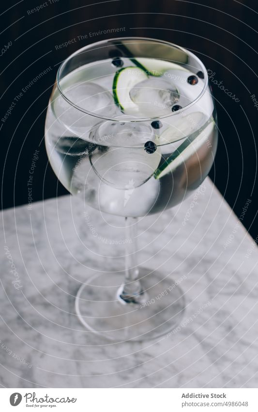Gin tonic with cucumber and ice cocktail gin cold drink refresh alcohol glass beverage refreshment booze slice aperitif tasty party liquid serve cool pub