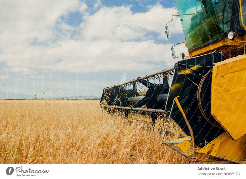 Combine harvester working in a cereal field agriculture barley combine combine harvester countryside dirt environment equipment farm grain industrial landscape