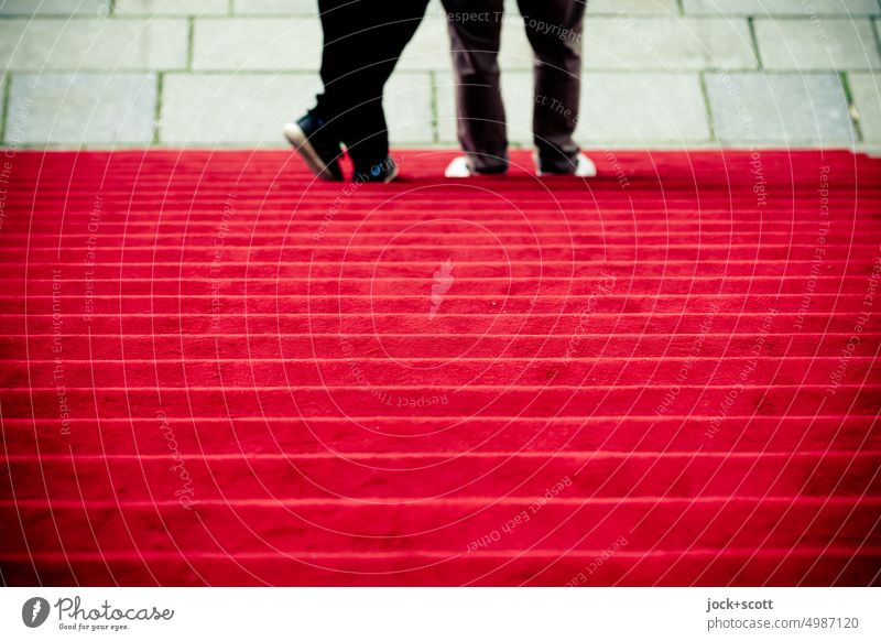 casual and steady on the red carpet Red carpet Stairs Structures and shapes Bird's-eye view Legs Symmetry Symbols and metaphors Human being Couple Site Steps