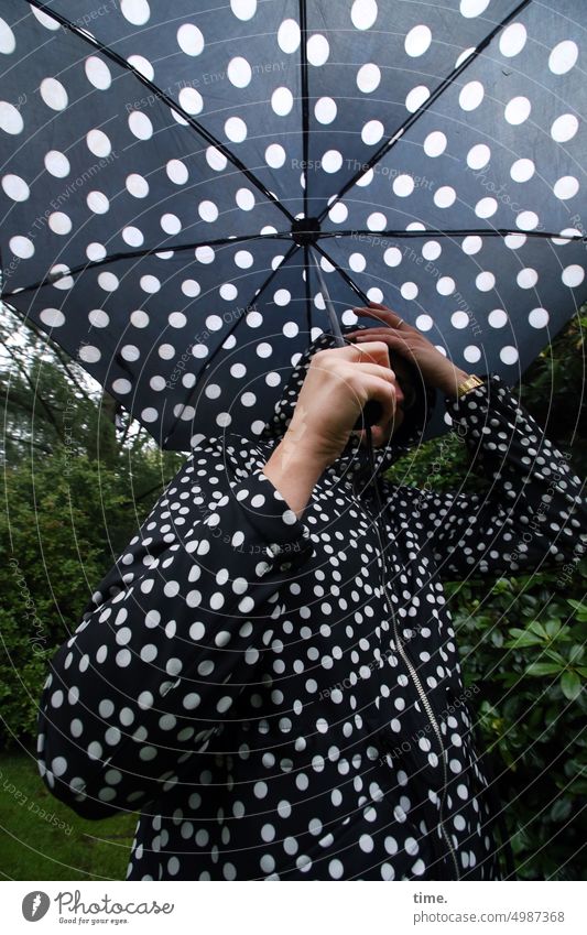 Unnamed Roads | Point winner, still Woman Umbrellas & Shades Spotted Rain jacket Park bush feminine stop Bad weather