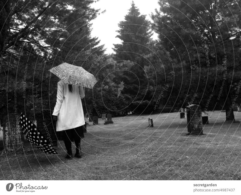 [HH unnamed road] So close to death Death Woman Black & white photo sad rainy Cemetery Peace Lawn Nature Umbrella Grief Grave Tombstone Transience Exterior shot