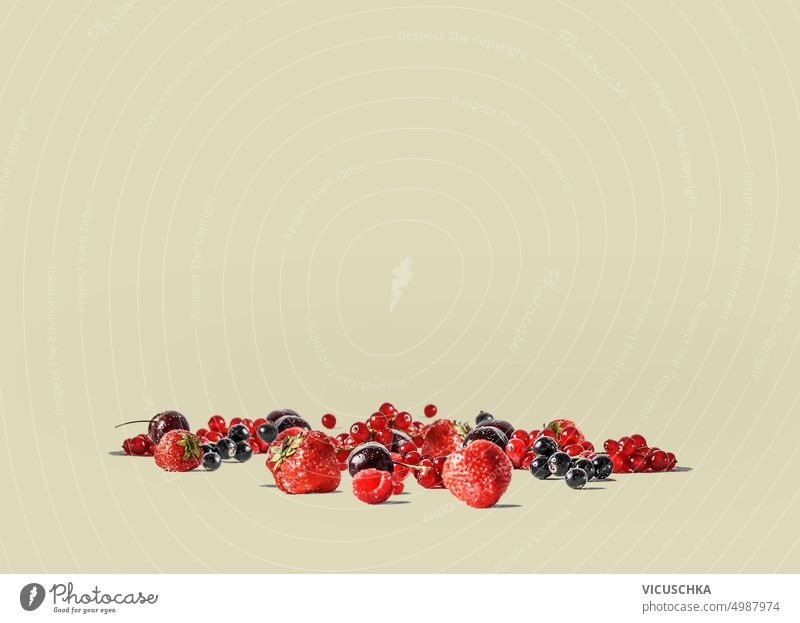 Various fresh fruits and berries scattered over a beige background. various juicy group health natural closeup delicious vitamin tasty harvest healthy berry raw