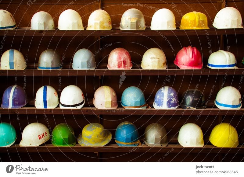 Collection of used hard hats are ready Helmet Work and employment Protection Safety Occupational health and safety Industry Old GDR Row Shelves Workwear