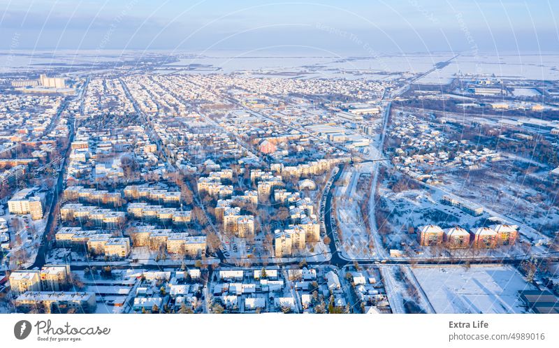 Above view on cityscape covered with snow, appearance of the city in winter. Aerial Architecture Attic Building City Cityscape Climate Cold Complex Construction