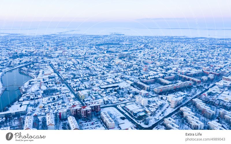 Above view on cityscape covered with snow, appearance of the city in winter. Aerial Architectural Attic Bridge Buildings City Cityscape Climate Cold Cool