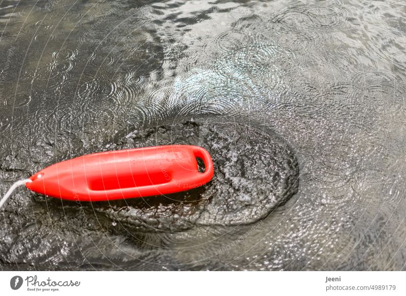Saving buoy in water Water Lake Protection water rescue Drown Lifebuoy Swimming & Bathing be afloat Rescue Lifeguard Safety Emergency First Aid Red sure Help