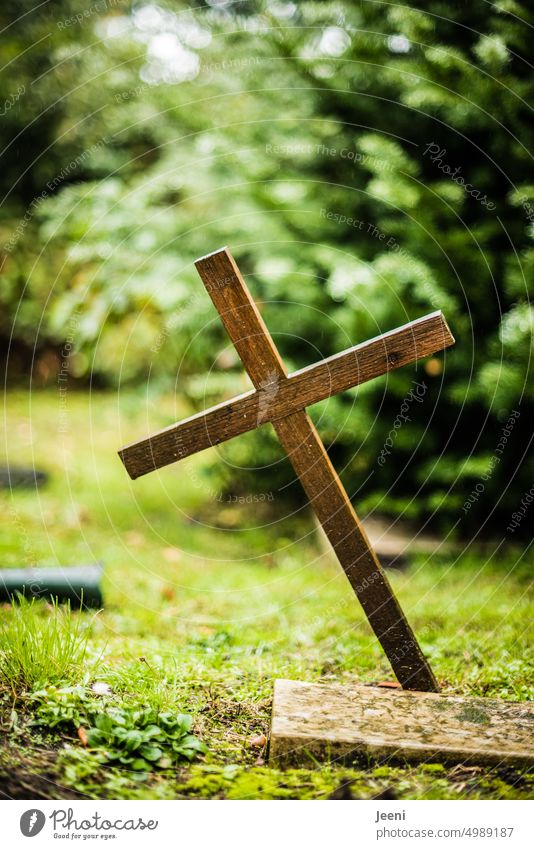 [HH Unnamed Road] Crooked wooden cross Crucifix Wooden cross Cemetery Grave slanting tilted position obliquely Death Christian cross Grief Religion and faith