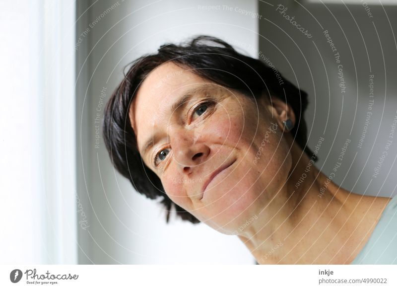 Good morning! Good morning! Colour photo Close-up portrait Interior shot at the window a woman alone Bright naturally Authentic Smiling eye contact