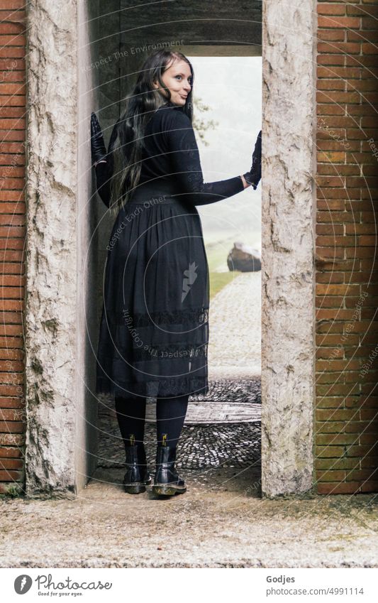 [HH Unnamed Road] A woman dressed in black in a doorway... Woman Way out Entrance End commemoration Gothic style Black Shadow Light Religion and faith Sadness