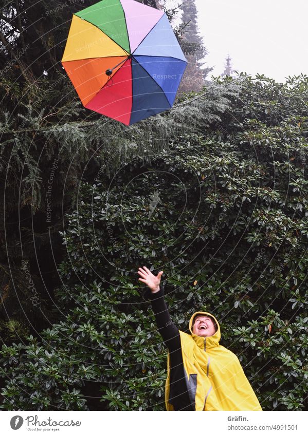[HH Unnamed Road] Throwing rainbow umbrella at rain - woman throws colorful umbrella in air Rain Umbrella rainy day daylight Park outdoor Exterior shot