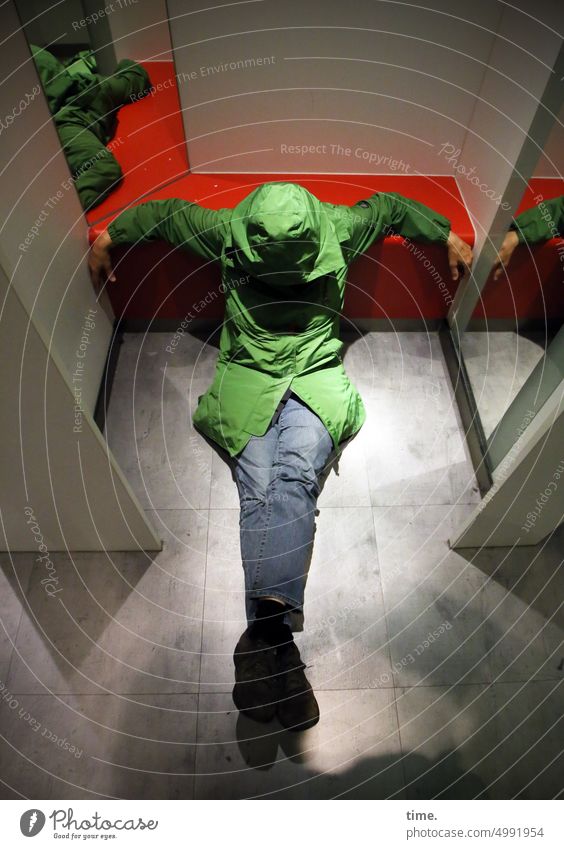 ArtCityTour | ShowdownShow dressing Woman Sit Green Raincoat jeans Mirror Room floor Parquet floor actress somber Shadow Artificial light cabin