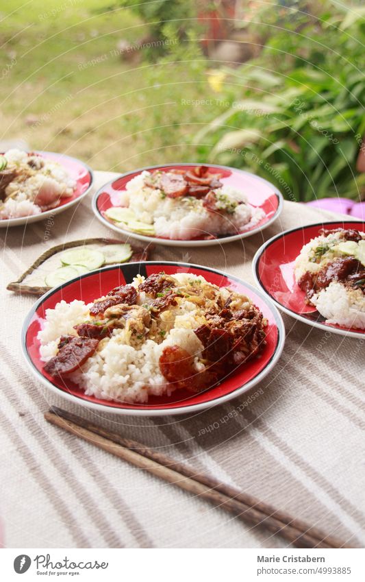 Chinese sausage or lap cheong and rice for breakfast on an outdoor table during a warm summer morning Healthy Eating Day Homemade Food Meal Breakfast Asian Food