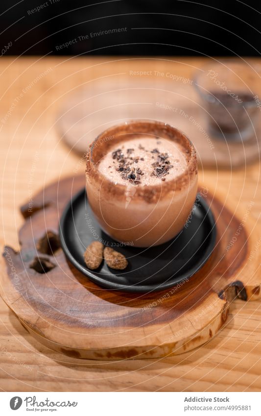 Cup of Champurrado on table champurrado hot drink cup chocolate tradition cocoa slab wooden cafe chiapas mexico serve beverage cuisine mexican thick delicious