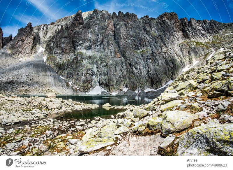 2022 06 04 CimaDasta lake between granite peaks mountain alpine nature italy landscape summer outdoor view alps green tourism valley sky blue scenic trentino