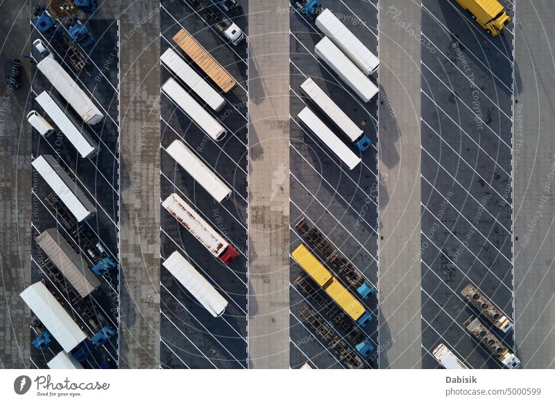Top view of trucks on parking lot near logistic warehouse trailers transport top view cargo transportation delivery highway semi truck shipping load business