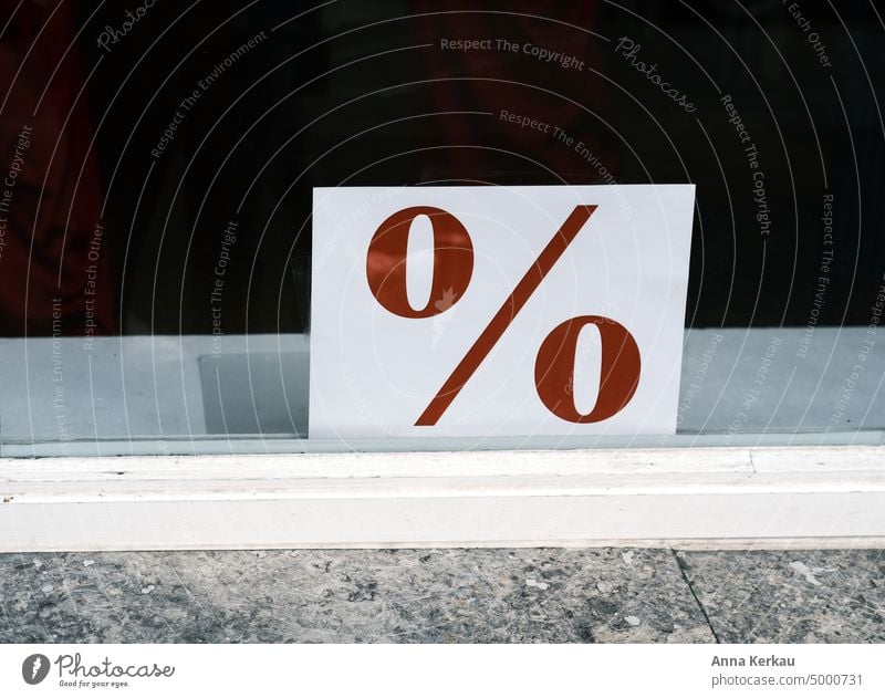 Making a bargain- a notice in the shop window about a discount promotion. Discount Retail sector Grab a bargain Discount offers Price reduction special offer