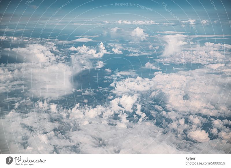 Beautiful View Of Fluffy Clouds In Sky From Height Flight Of Plane. Natural Background. aerial aerial view attitude backdrop background beautiful cloud