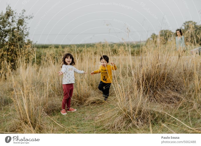 Brother and sister in the fields Brothers and sisters Family & Relations Together togetherness explore Nature Child childhood Emotions Human being Colour photo