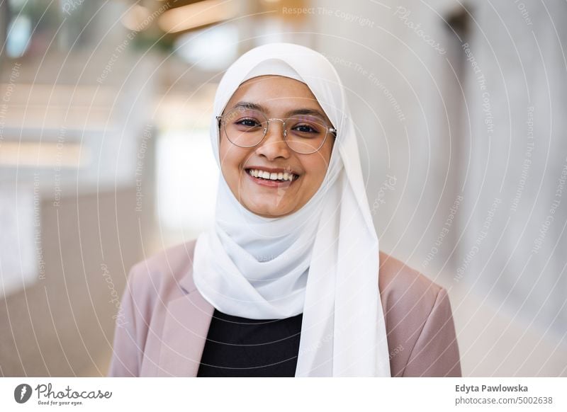 Portrait of beautiful muslim woman wearing hijab Thai scarf islam islamic university business office real people young adult student positive smiling cheerful