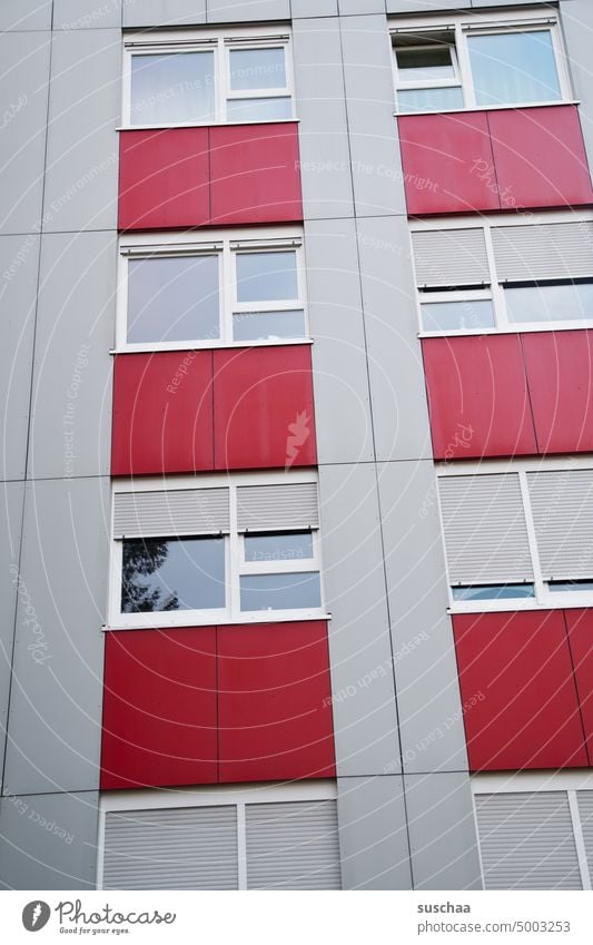 house wall somewhere in germany High-rise Town urban Facade Building Architecture Apartment Building apartment building block of flats Window Gray Red boringly