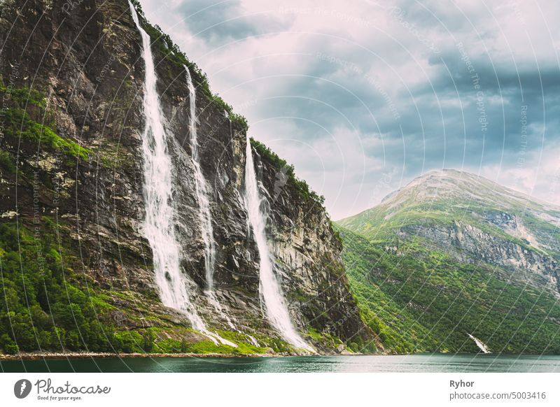 Geirangerfjord, Norway. The Seven Sisters waterfalls In Geirangerfjorden. Famous Norwegian Landmark And Popular Destination In Summer Day More og Romsdal county