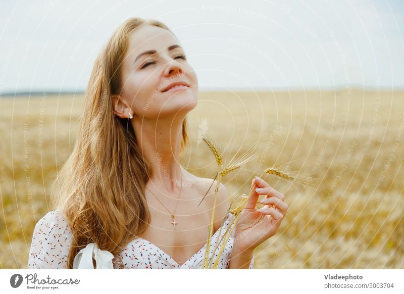 Beautiful woman portrait with closed eyes with wheat ears in field beautiful summer female person beauty girl young hair nature happy attractive natural pretty