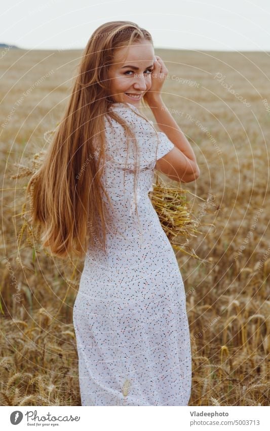 Beautiful woman in rye field in white dress. Rural lifestyle Lifestyle Field Woman pretty Dress White Rye Nature Happiness Girl Smiling naturally Summer