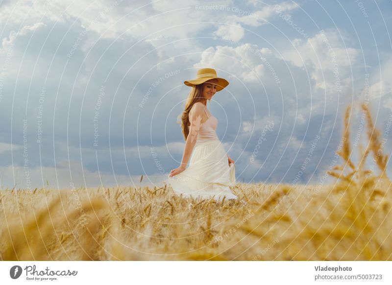 Woman in rural dress and hat dancing alone in wheat field woman summer back dance freedom view rye hair blonde wicker blue elegant rustic country nature