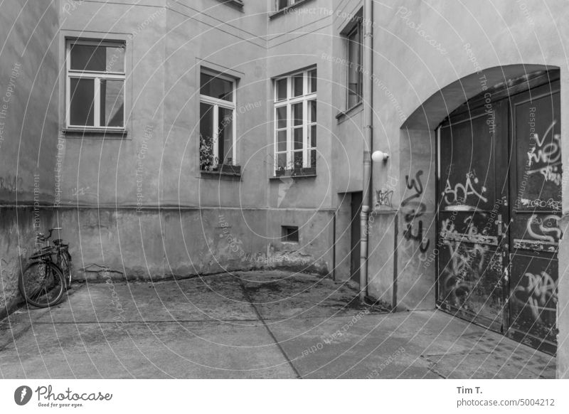 Backyard with bike in Prenzlauer Berg Berlin b/w Window Interior courtyard Courtyard Downtown Old building Town House (Residential Structure) Day Deserted