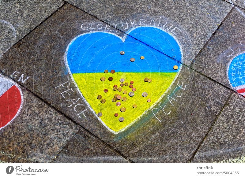 Ukraine colors in heart shape with chalk on sidewalk flag off Street War Peace Solidarity Politics and state Symbols and metaphors Ukraine war Freedom Russia