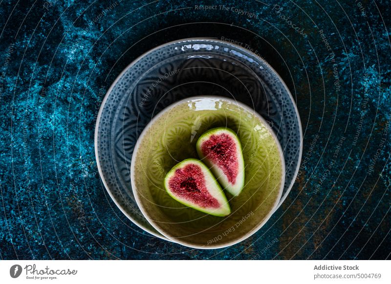 Ripe fig slices on the plates appetizer autumn autumnal background cold colorful crop dark eat eating fall fall time festive food glass half harvest healthy