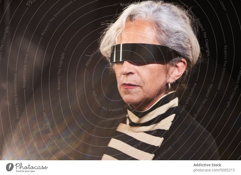 Elderly woman in futuristic sunglasses style appearance model accessory portrait gray hair modern female elderly senior aged pensioner retire serious