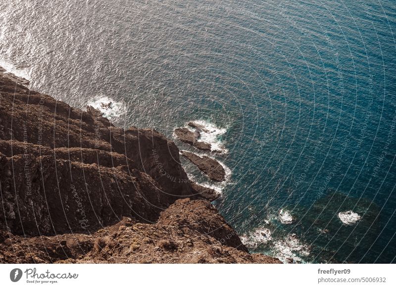 View from above of a volcanic cliff over the sea copy space rocks canary islands spain ocean black sky nobody trip creek place coast coastline canarian