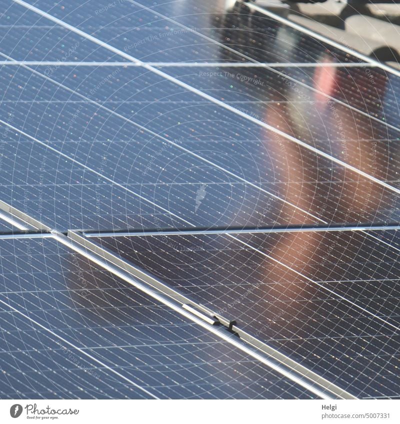 Solar modules are mounted on the roof, installer blurred mirrored on the surface solar solar panel Solar Power Energy Energy generation Renewable energy