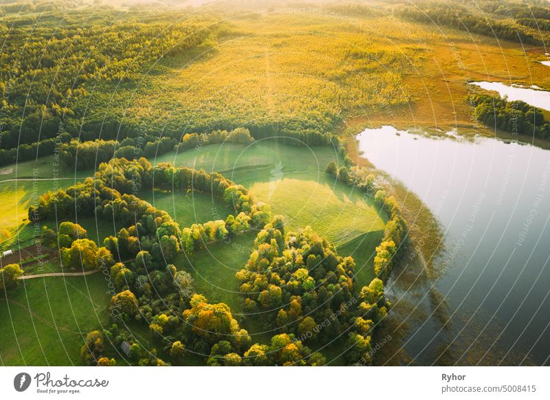 Aerial View Of Green Forest And Meadow Hill Landscape Near River. Top View Of Beautiful Nature From High Attitude. aerial aerial view attitude beautiful