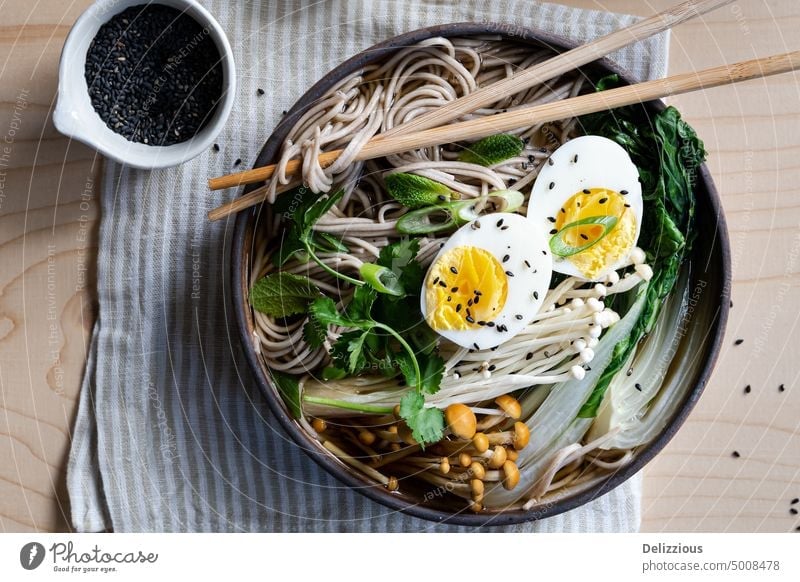 Top down view of Japanese ramen soup on striped napkin horizontal noodle japanese dish food bowl recipe noodles egg boiled egg prepared food and drink tasty