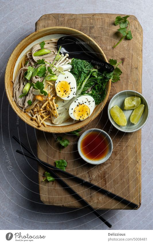 Top down view of Japanese ramen soup with boiled egg on wooden board, copyspace noodle japanese dish food bowl recipe noodles prepared food and drink tasty