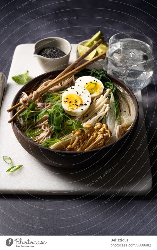 Side view of Japanese ramen soup with boiled egg on white marble , copyspace side view noodle japanese dish food bowl recipe noodles prepared food and drink