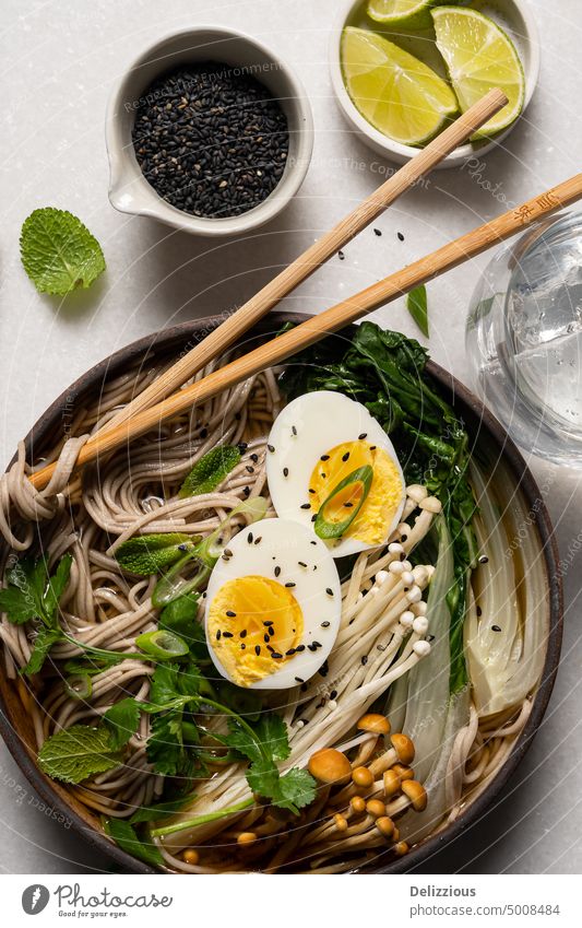 Top down view of Japanese soba noodle ramen soup on white background japanese dish food bowl recipe noodles egg boiled egg prepared food and drink tasty asian