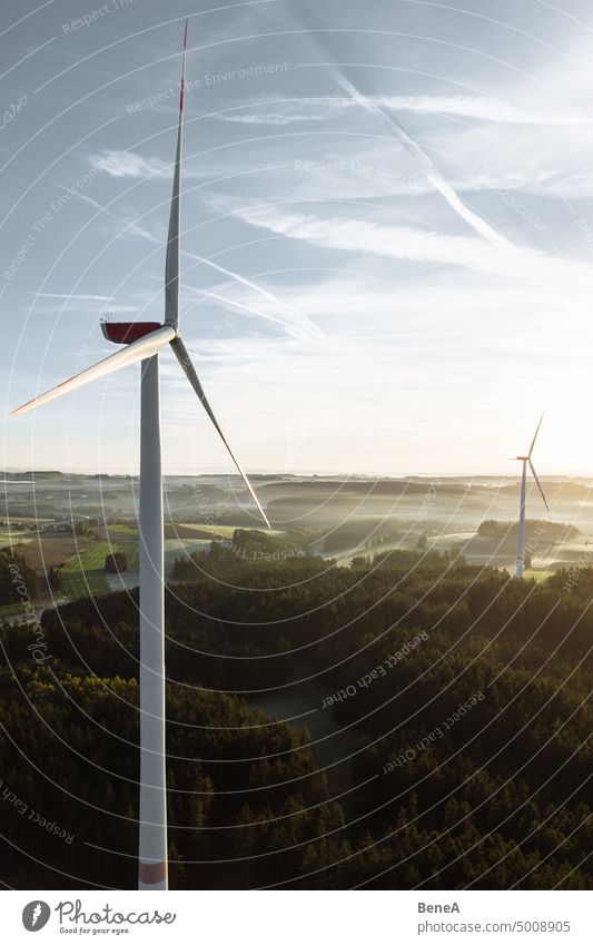 Wind turbine in the sunrise seen from an aerial view Aerial Clean Cleantech Converter Country Countryside Electrical Electricity Energy Forest Future Generation
