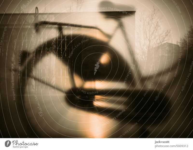 Silhouette from rear wheel Bicycle Reflection blurriness Light (Natural Phenomenon) Hazy Artificial light Background lighting milky Structures and shapes