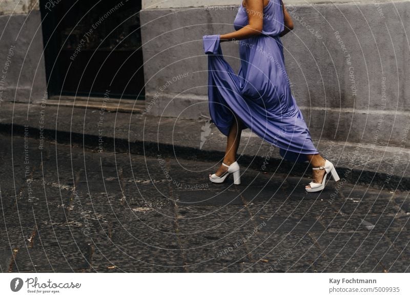 woman wearing an elegant dress crosses a street in Italy beauty documentary documentation elegance fashionable female holding italy lady luxury mysterious