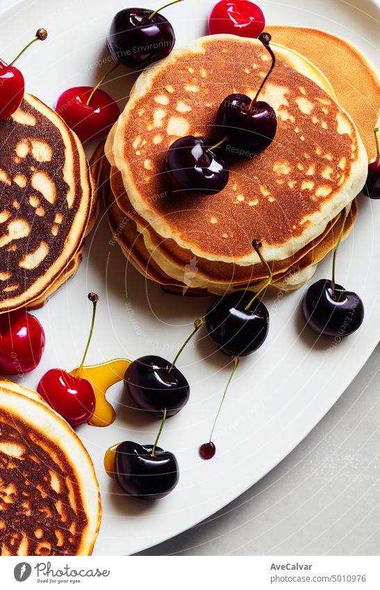 Sweet pancakes with ricotta and cherries. black pancakes. breakfast. top view, copy space stack syrup horizontal photography morning pouring close-up freshness