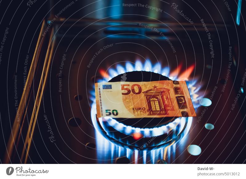 Gas prices rise - money is burned gas prices Expensive Money incinerate sb./sth. Gas stove Energy Invoice Heat Heating concept Euro Bank note symbol Save