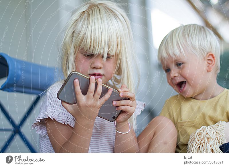 unnecessary l cell phone use by children.... Child Parenting Infancy Children's game Girl Boy (child) Face Brothers and sisters Playing Together Media Cellphone