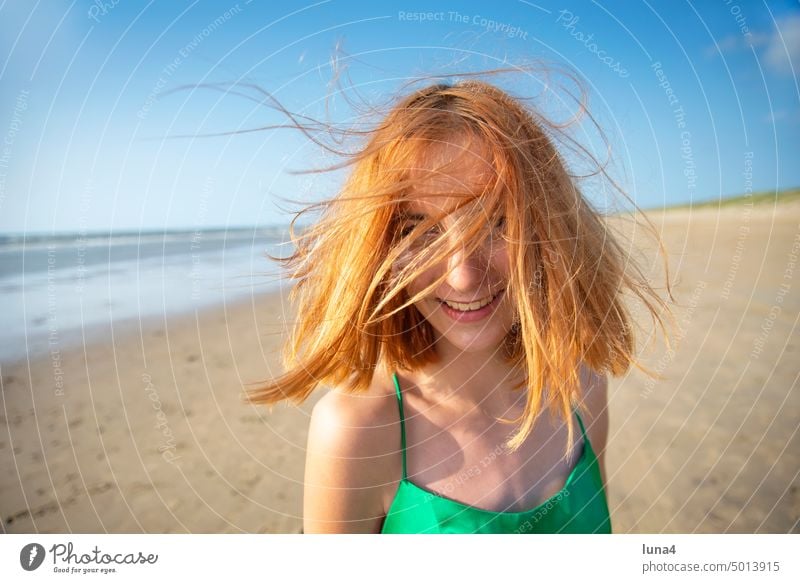 happy girl with disheveled hair on beach Girl Beach Ocean cheerful Laughter Happy teenager fortunate Disheveled Wind windy Gale Weather Joy untroubled