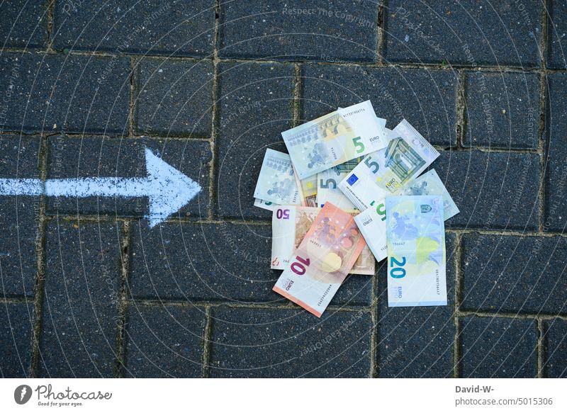 Arrow points to a pile of money Money Indicate Euro a lot Bank note Luxury Loose change Save finance bottom Lie